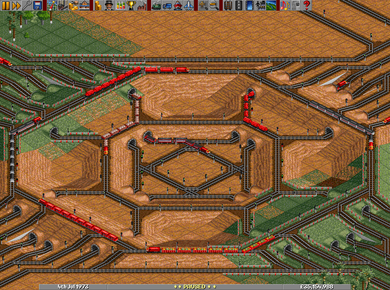 A complex four way junction in a sandy desert.